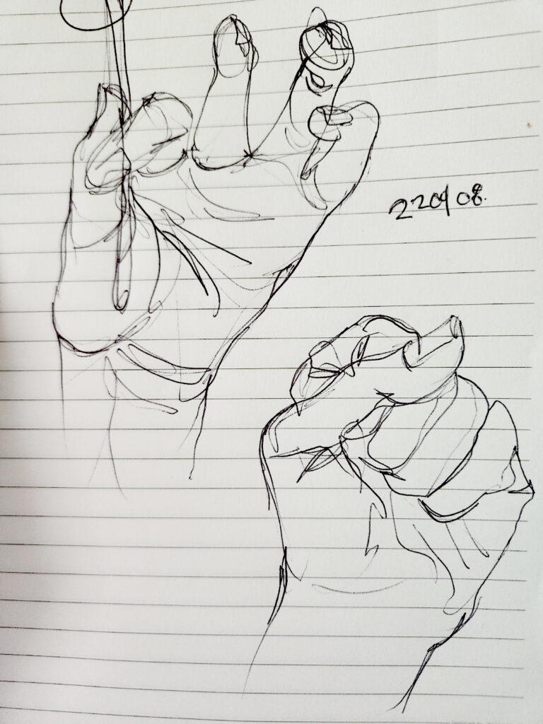 Two drawings of hands in different poses. Drawing on a note.